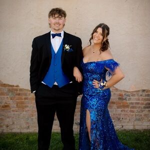 Elegant Blue Sequin Gown and Black Suit Ensemble